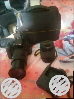 Black Canon DSLR Camera With Lens