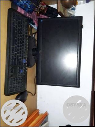 Black Flat Screen Computer Monitor And Black Computer Keyboard