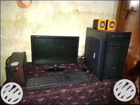 Black Computer Monitor, Keyboard, And Tower