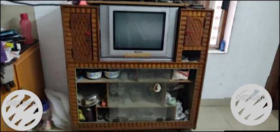 Brown Wooden TV Hutch With Gray CRT Television