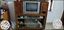Brown Wooden TV Hutch With Gray CRT Television