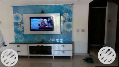 Flat Screen Television With White Wooden TV Hutch