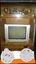 Gray CRT Television With Brown Wooden TV Hutch