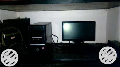 Black Flat Screen Computer Monitor And Black Computer Keyboard