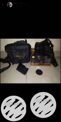 Black Nikon DSLR Camera With Bag
